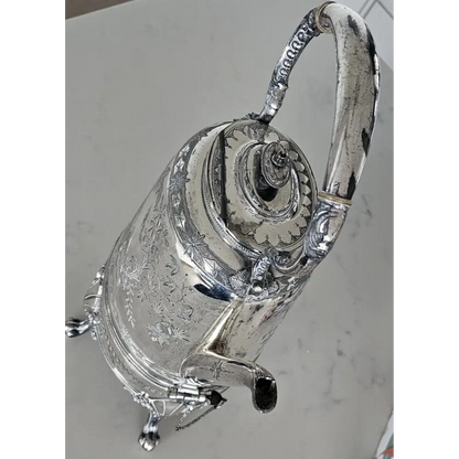 Silver teapot with intricate designs