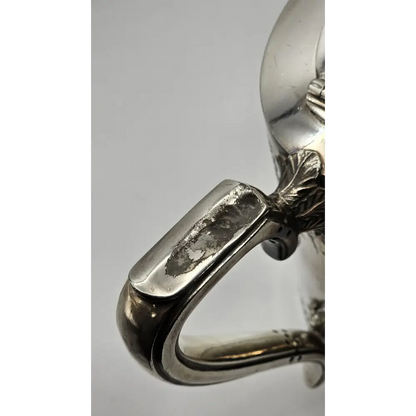 Close-up of a silver ring with intricate design 