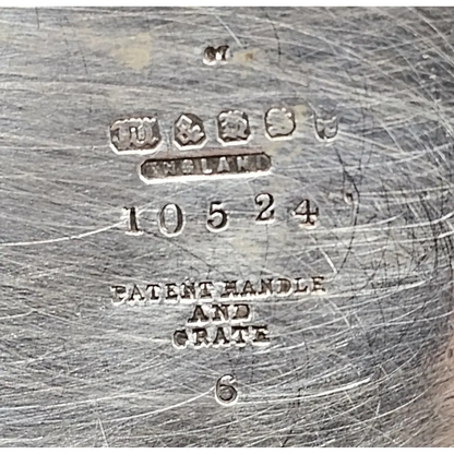 Close-up of a metal object with engraved text and numbers