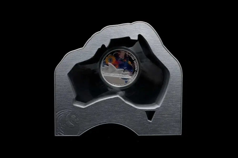 A silver-colored commemorative coin displayed in a custom-shaped metallic holder from our World & Vintage Coins collection