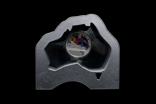 A silver-colored commemorative coin displayed in a custom-shaped metallic holder from our World & Vintage Coins collection