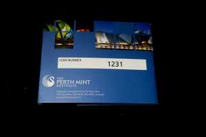 A blue collectible coin holder from Perth Mint, featuring images of Perth landmarks and the coin number 1231, set against a solid black background.