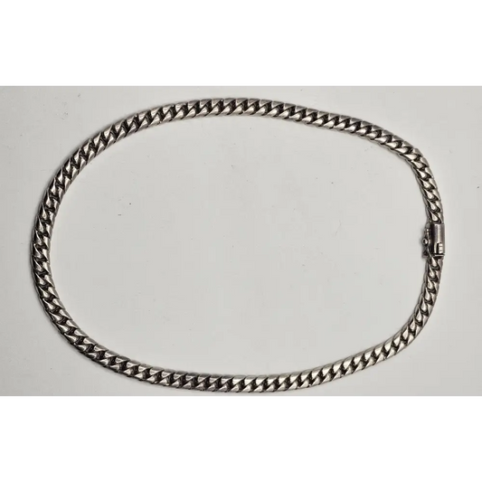 Silver chain necklace on a white background