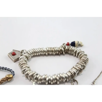 Silver bracelet with various charms 