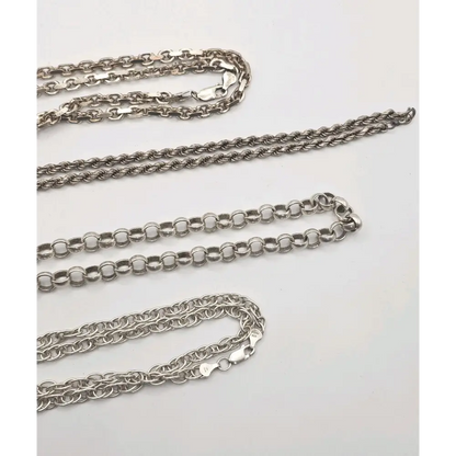 Four silver chains of different designs 