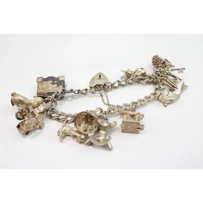Silver charm bracelet with various charms