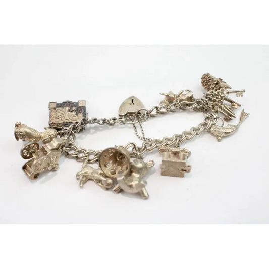 Silver charm bracelet with various charms