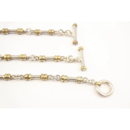 Close-up of a gold and silver chain