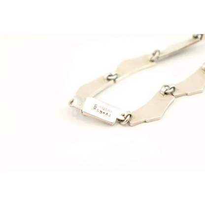 Gold bracelet with a tag 