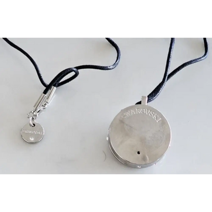 Silver necklace with a round pendant 