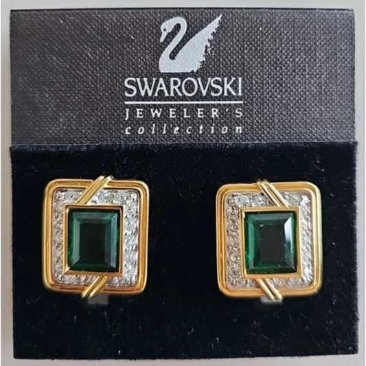 Swarovski earrings with green gemstones on a branded card
