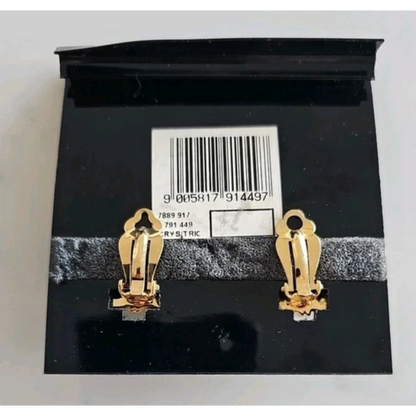 Gold earrings on a black card with a barcode and text