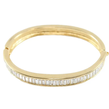 Gold bracelet with diamond accents on a white background