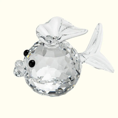 Crystal fish figurine on a white background