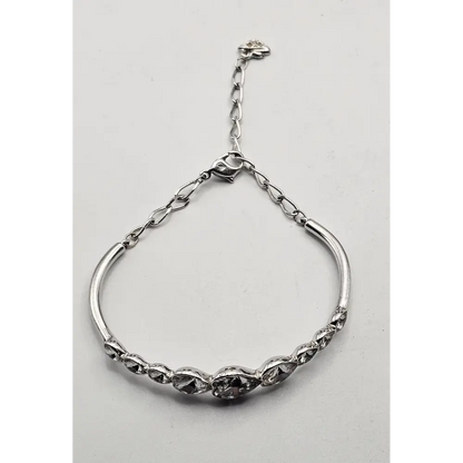 Silver bracelet on a light gray background