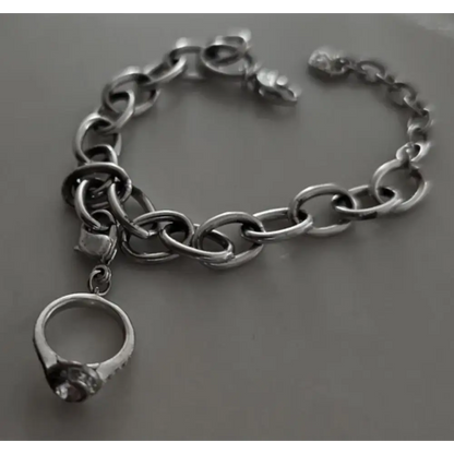 Silver chain bracelet with a ring charm