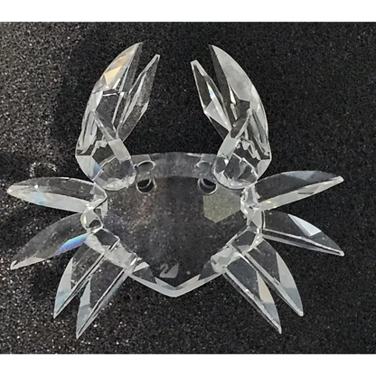 Clear crystal crab ornament on a black background
