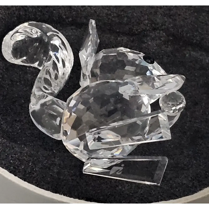 Crystal duck figurine on a black background