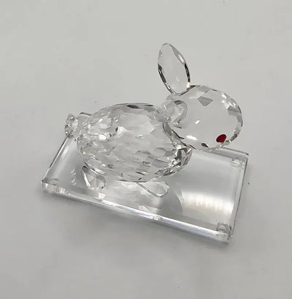 Clear crystal rabbit figurine on a white background