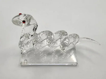 Clear glass swan ornament on a white background