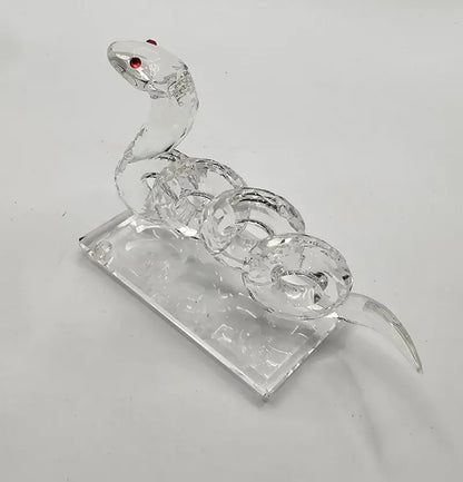 Crystal snake figurine on a white background