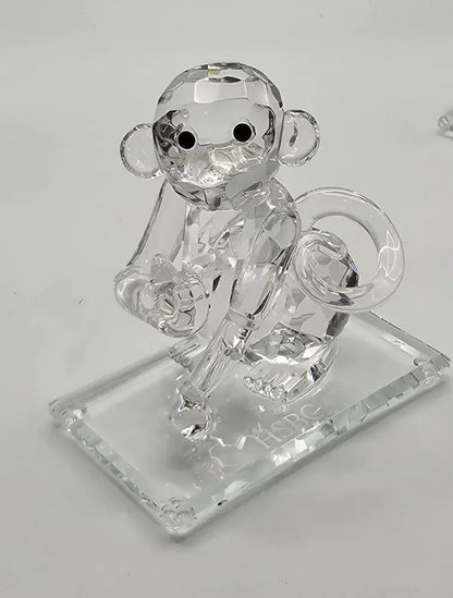 Crystal monkey figurine on a clear base