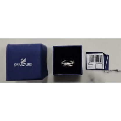 Swarovski ring in packaging with a blue Swarovski pouch and box on a white background.