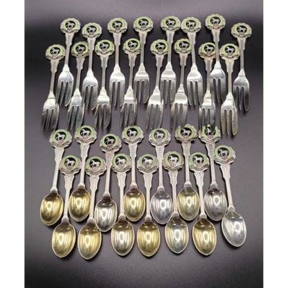 Set of silver spoons and forks with decorative handles