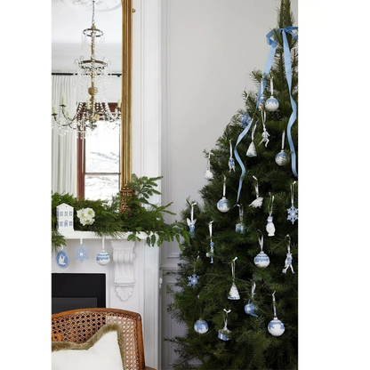 Decorated Christmas tree with blue and silver ornaments 