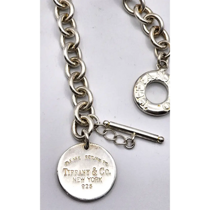 Silver chain bracelet with a tag featuring Tiffany & Co. branding