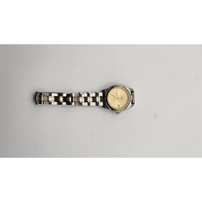 Wristwatch with a metal band on a light gray background
