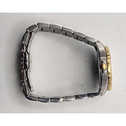Metallic watch case with gold and silver accents