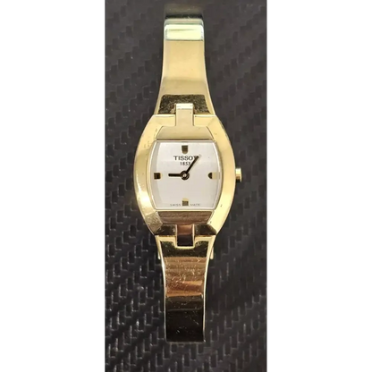 Gold wristwatch with a white face