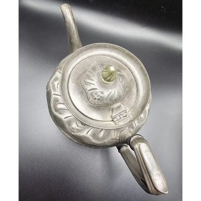 Silver decorative object with intricate designs 