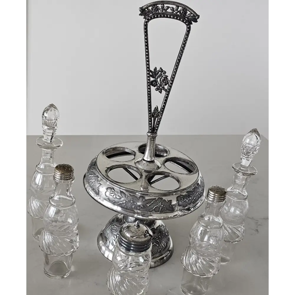 Silver epergne with crystal bottles