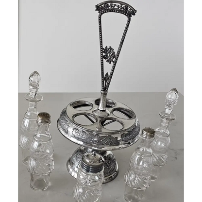 Silver epergne with crystal bottles