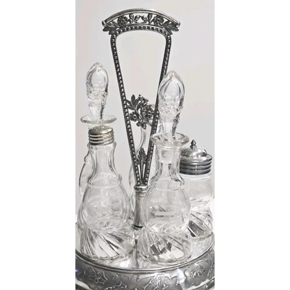 Set of glass bottles with silver metal stands on a white background