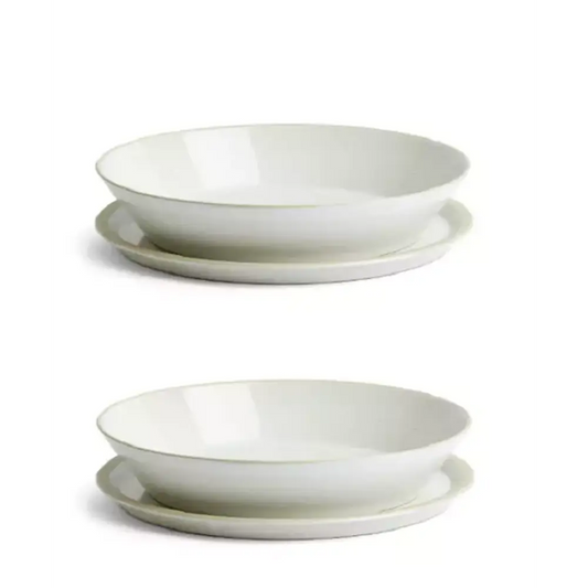 Two white ceramic bowls stacked on top of each other