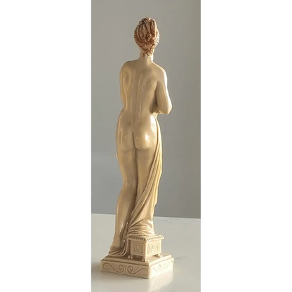 Vintage Art Deco nude sculptures displayed on a shelf