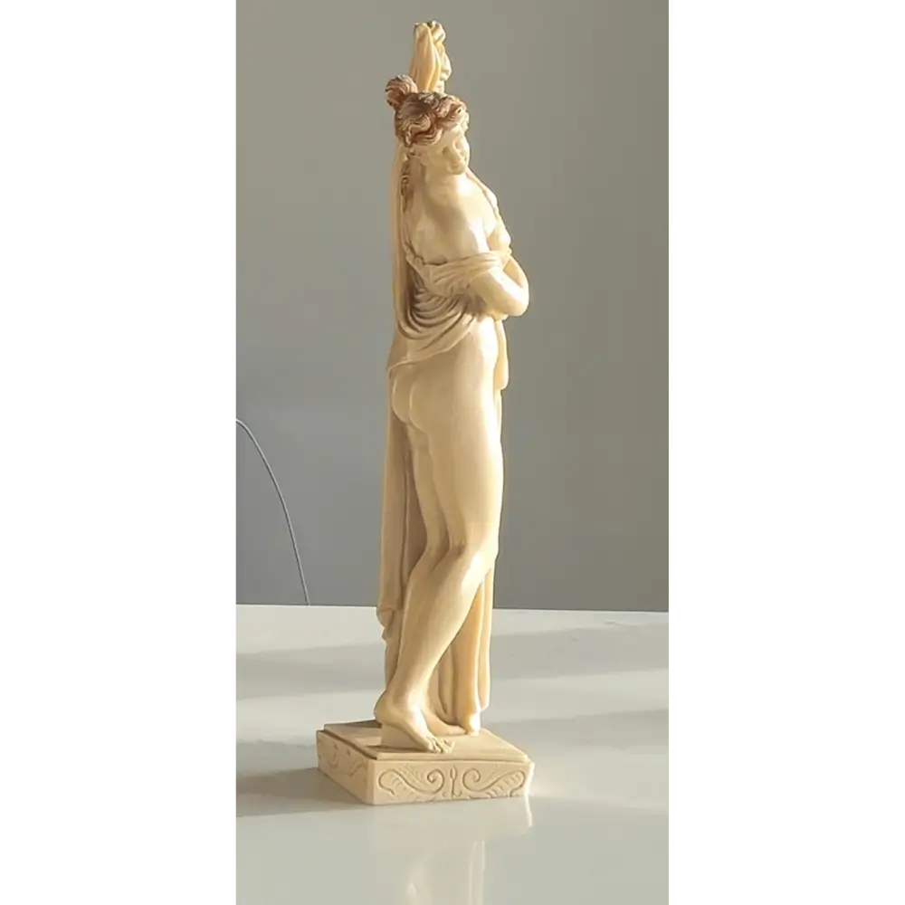 Vintage Art Deco nude sculptures displayed on a shelf