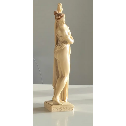 Vintage Art Deco nude sculptures displayed on a shelf