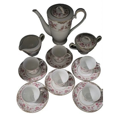 Full arrangement of cups, saucers, creamer, sugar bowl, and teapot
