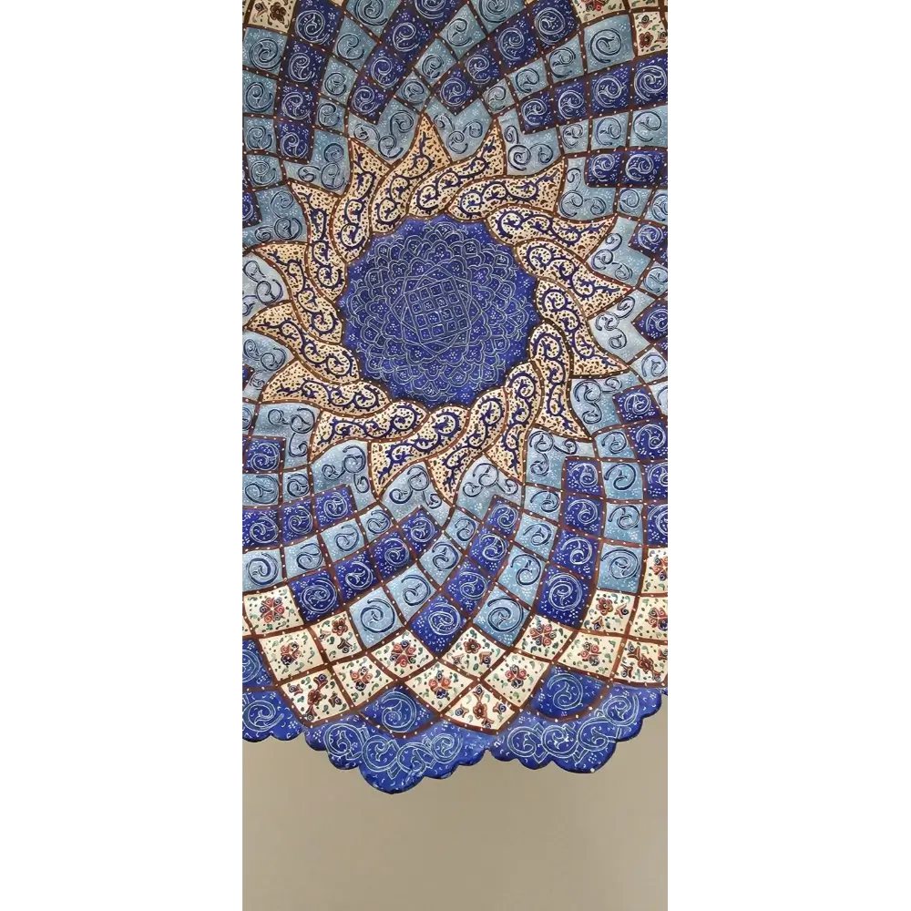 Decorative wall art with intricate blue and gold pattern on a beige background