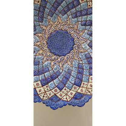 Decorative wall art with intricate blue and gold pattern on a beige background