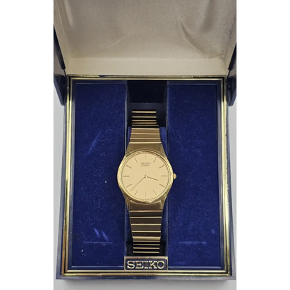 Gold Seiko watch in a box with blue interior