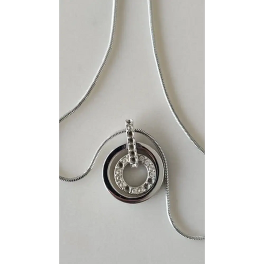 Silver necklace with a circular pendant