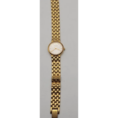 Gold wristwatch with a mesh band 