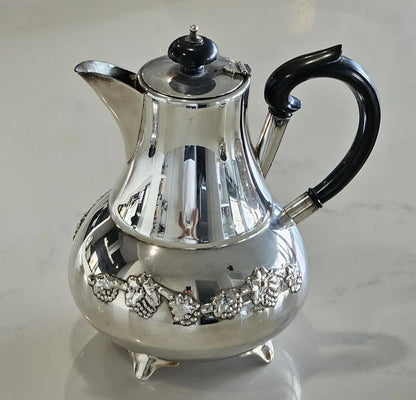 Waterhouse silver plated coffee pot with black handle and grape motif