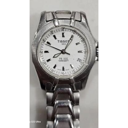 Silver Tissot watch with a white face
