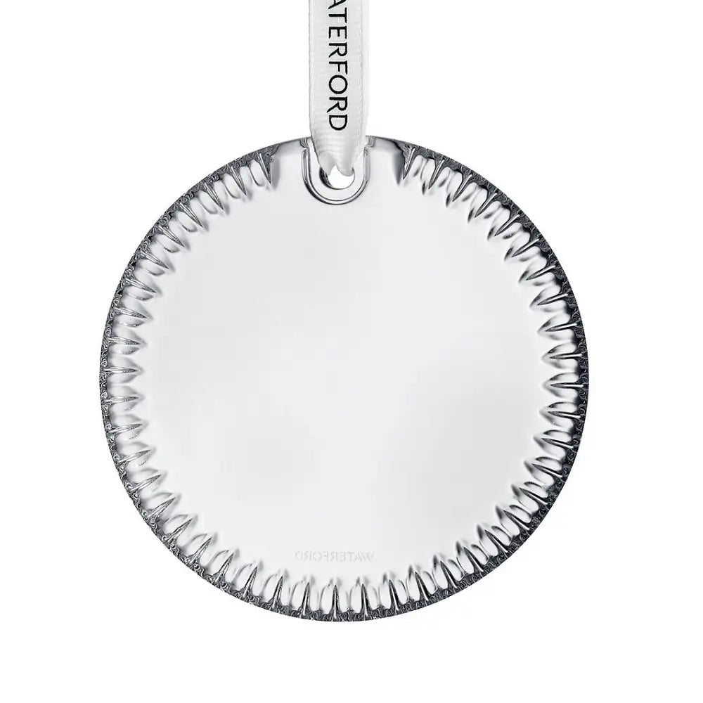 Round glass ornament with textured rim 
